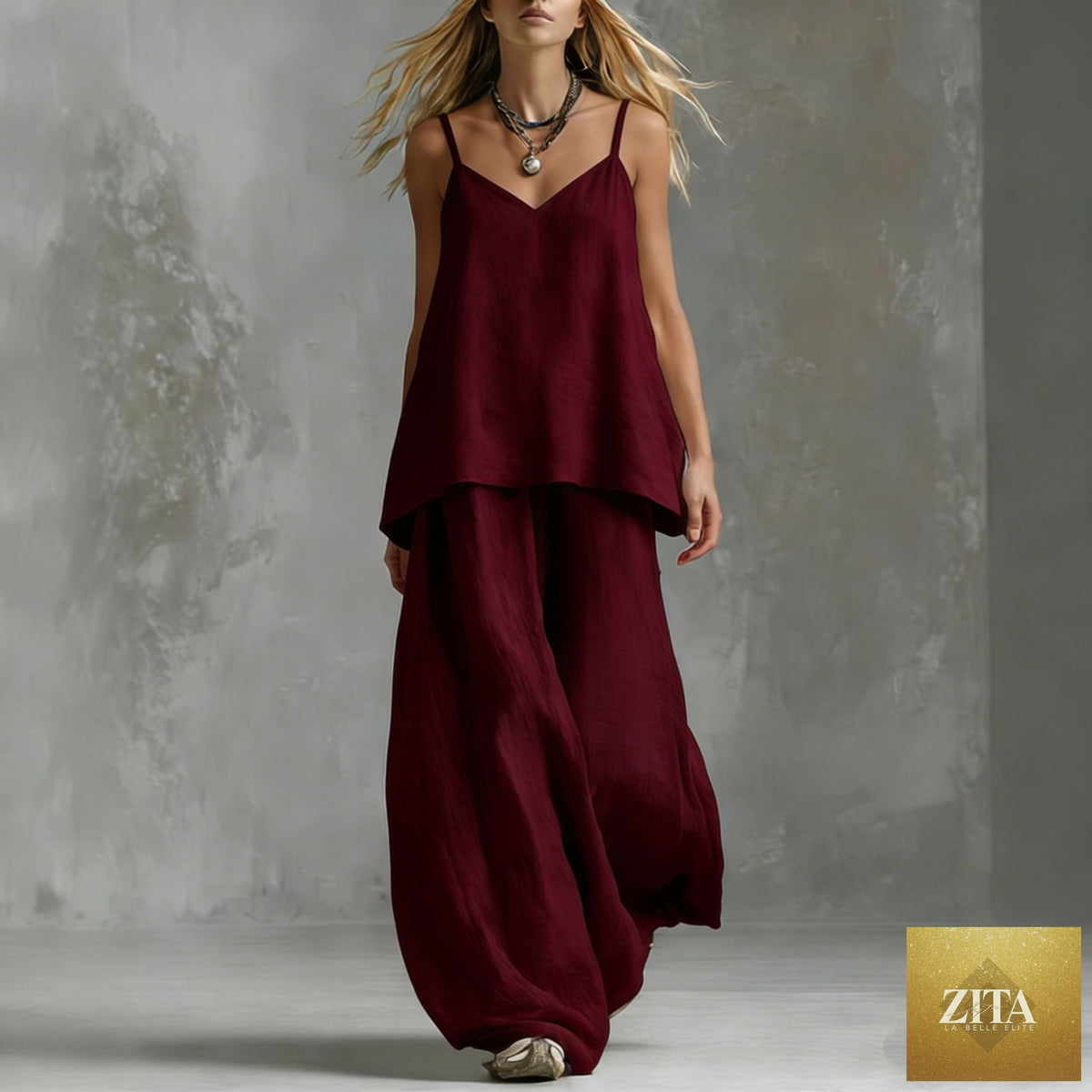 Women's sleeveless off-shoulder pantsuit set by FitiqueFit featuring a casual, elegant two-piece design with tailored pants and a matching top.