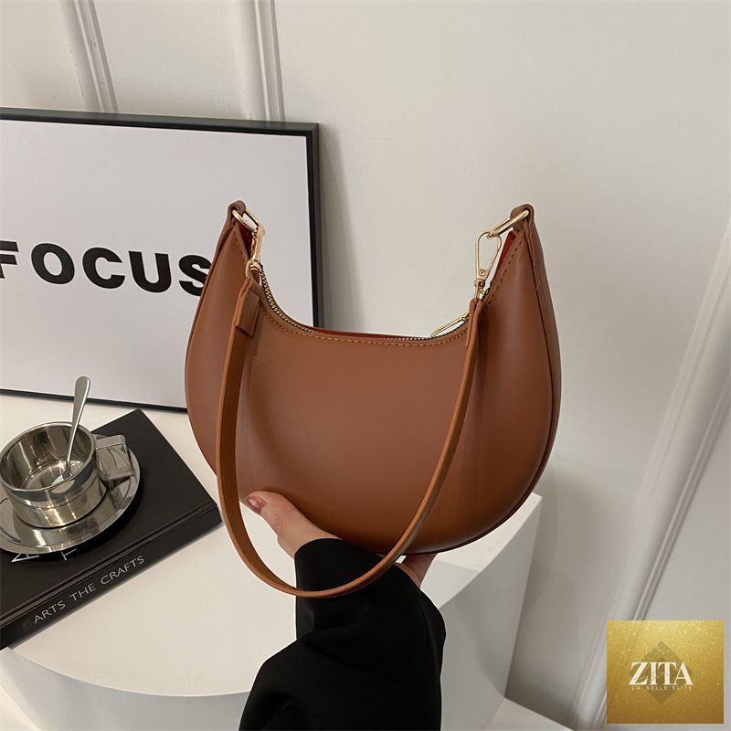 Textured shoulder bag for women, Niche Crescent New Simple All-Match model by Social Buzz eSIMs, featuring a stylish, versatile design.