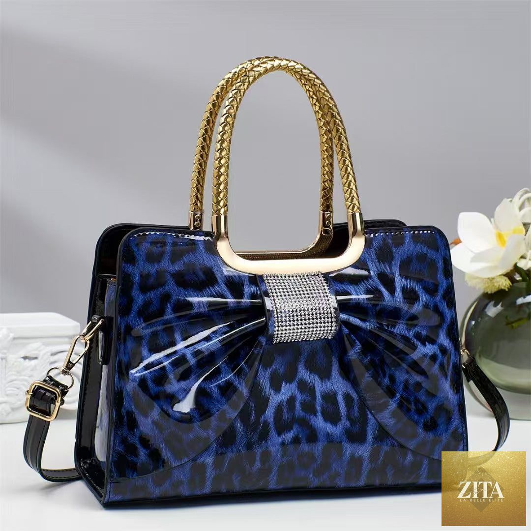 Elegant genuine leather women's handbag with leopard print and hot-stone embellishments, versatile and fashionable by Social Buzz eSIMs.