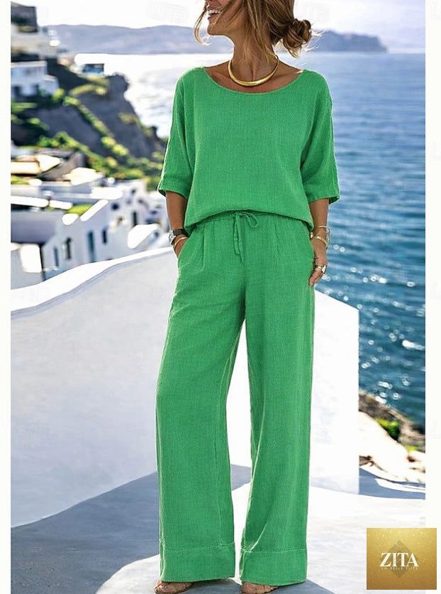 Women’s cotton linen resort set by Zita La Belle Elite featuring a short sleeve top and wide-leg pants, perfect for warm-weather wear.