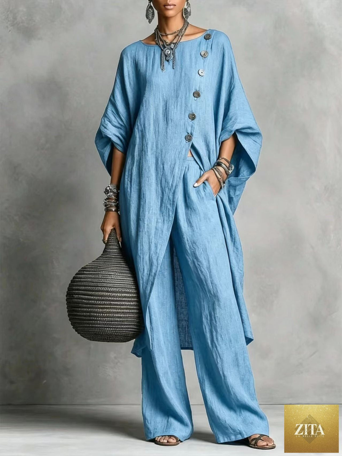 Women's casual drop shoulder three-quarter sleeve irregular shirt and matching pants set by Zita La Belle Elite, shown on a model.