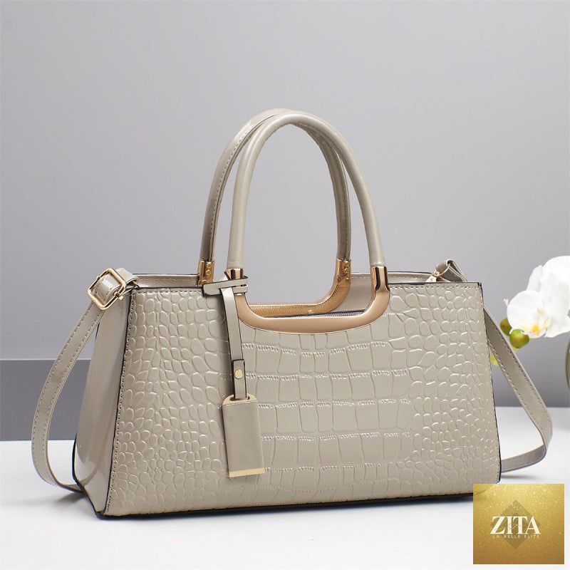 Elegant women's genuine leather wedding bag with shoulder and crossbody straps, stylish and versatile for special occasions.