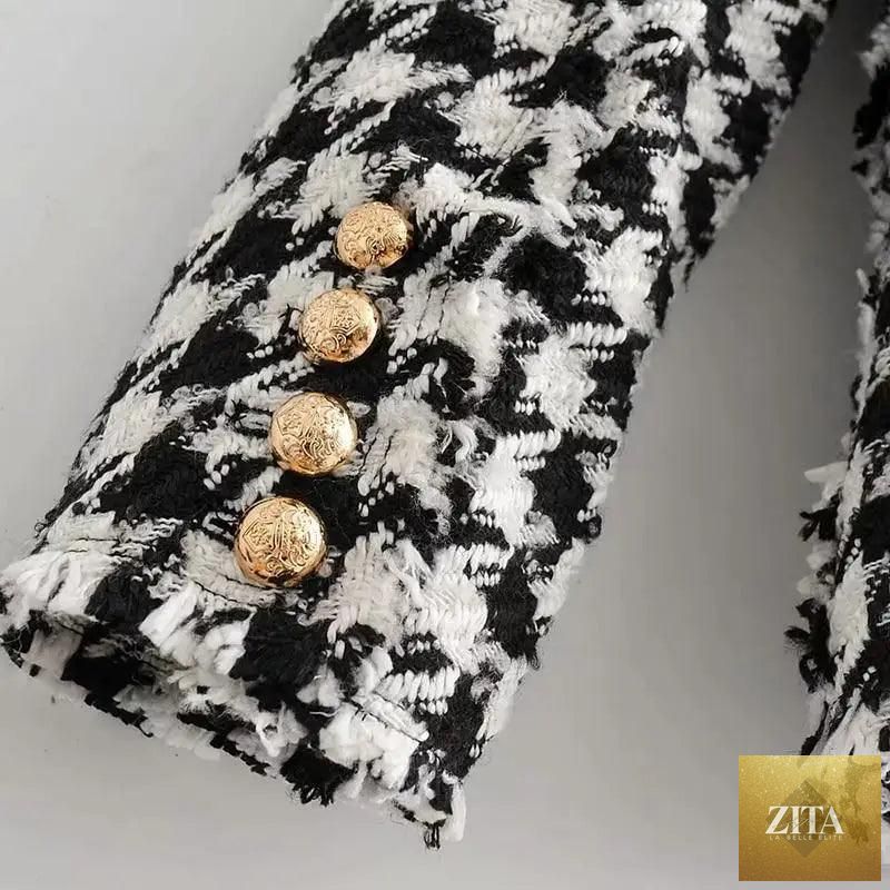 Black tweed jacket for women with tassel details, houndstooth pattern, suitable for office wear, styled for autumn fashion.