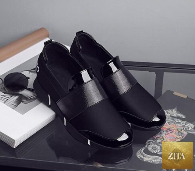 Black women's slip-on casual sneakers with soft soles, lightweight design, ideal for walking and everyday wear by Stevvex.