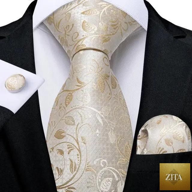 Elegant men's yellow gold tie set with matching handkerchief and cufflinks, perfect for wedding suits and formal occasions.