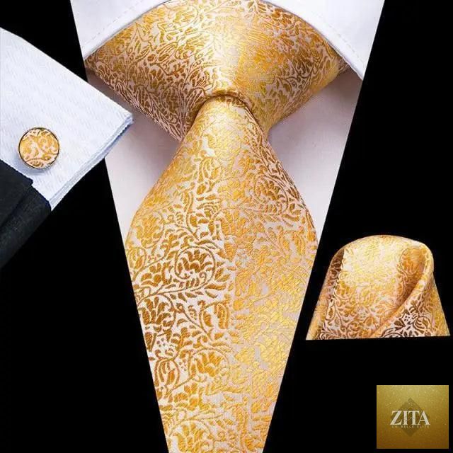 Elegant Stevvex yellow gold men's tie set with matching handkerchiefs and cufflinks, perfect for weddings and formal suits.