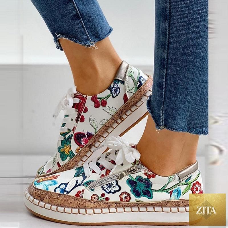 Elegant floral printed women's sneakers by Stevvex featuring lace-up design, round toe, flat casual style, suitable for walking.