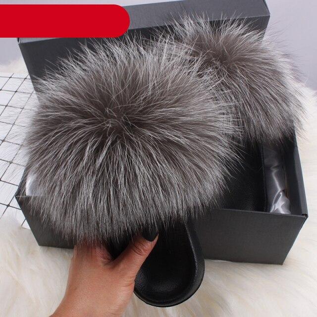 Stevvex women's indoor fur slippers featuring plush, fluffy open-toe slides with fox fur and feather accents for cozy comfort