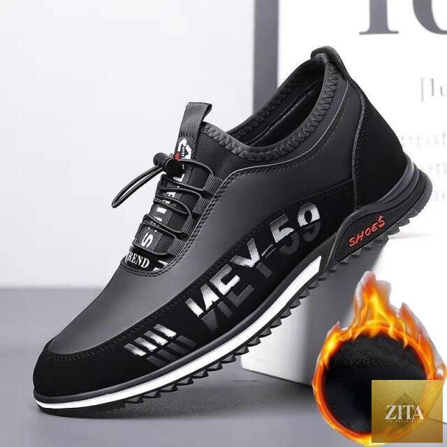 Stevvex black leather men's casual slip-on sneakers with low-top design, breathable, lightweight, anti-slip soles, suitable for walking and business.