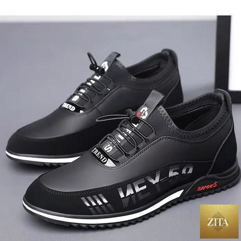 Stevvex men's black leather slip-on sneakers, lightweight, breathable, anti-slip soles, casual driving and walking shoes.