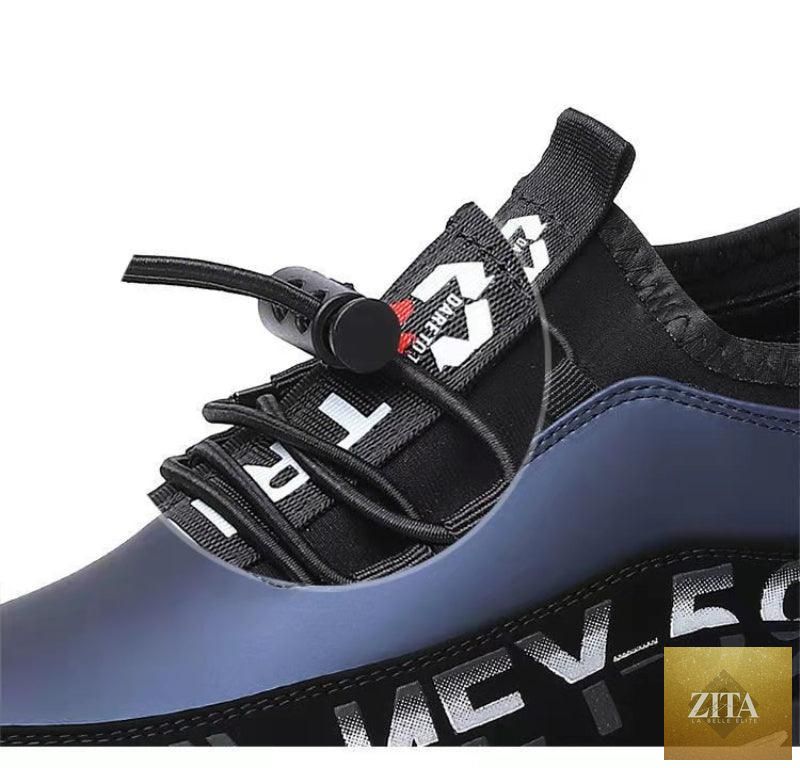 Stevvex men's black leather slip-on driving sneakers with breathable upper, lightweight design, anti-slip sole, and low-top style.