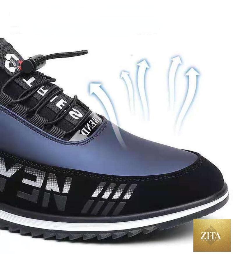 Stevvex men's black leather slip-on sneakers with low top design, breathable, lightweight, anti-slip sole, suitable for casual and business wear.