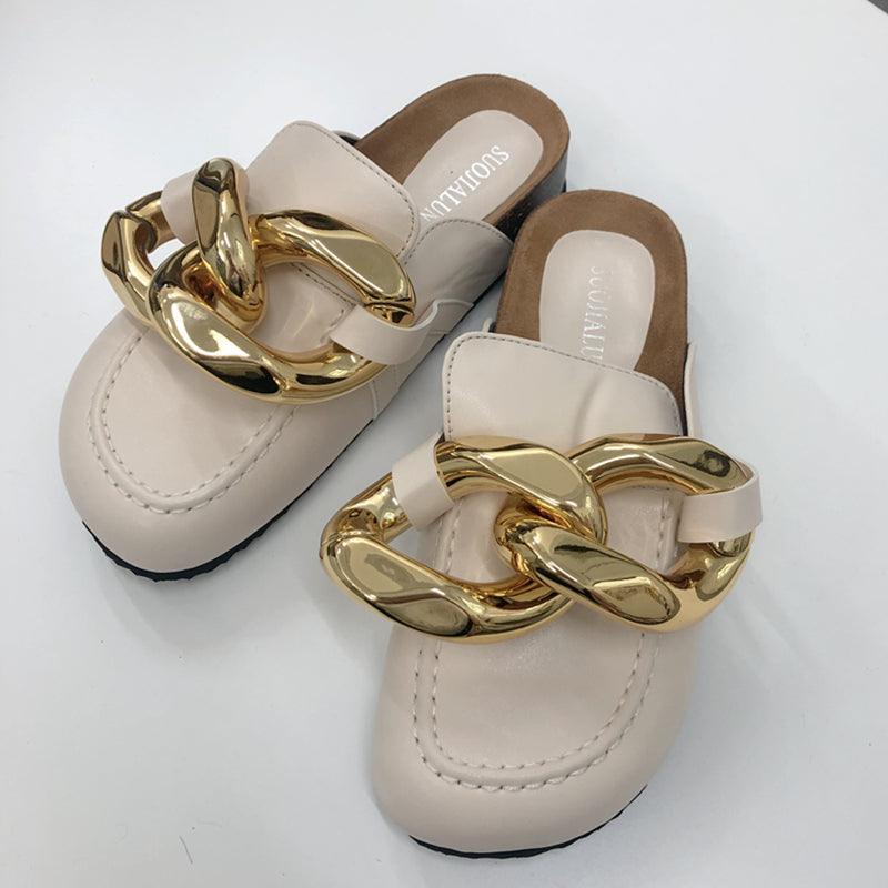 Stevvex women's slip-on sandals featuring a metal chain design, closed toe, round toe, low heels, casual flats, and gold accents.