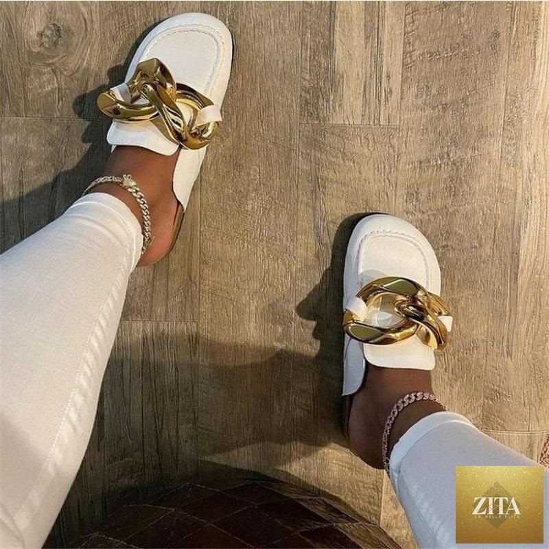 Stevvex women's summer flat slide sandals with metal chain detail, closed toe, low heel, casual slip-on design in gold.