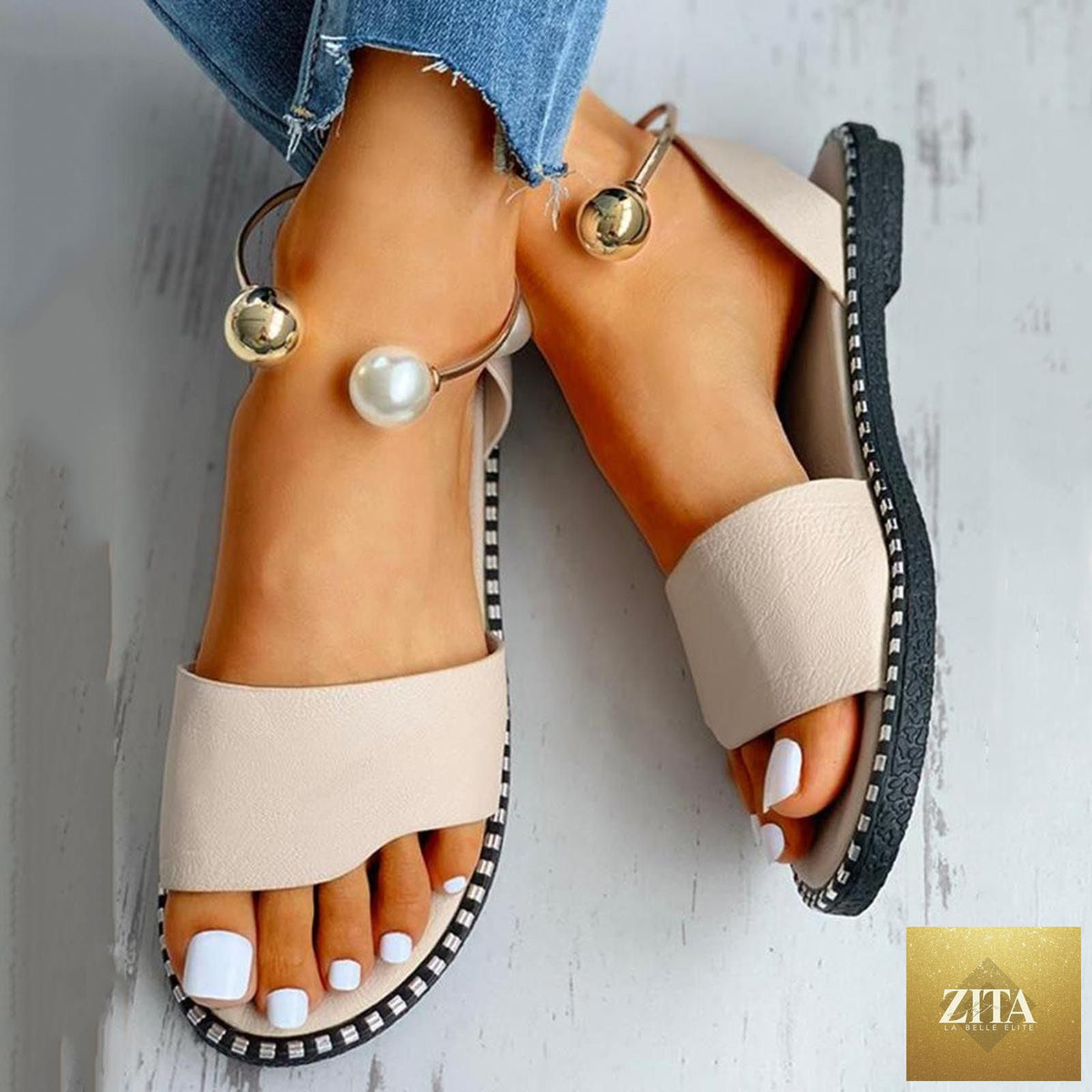 Stevvex white women’s fashion sandals with round toe, pearl buckle, strappy design, suitable for summer outdoor and wedding wear.