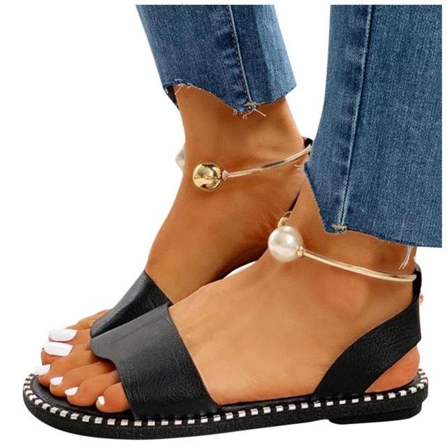 Stevvex white women’s fashion sandals with pearl buckle, round toe, strappy design, non-slip sole, suitable for summer and outdoor wear.