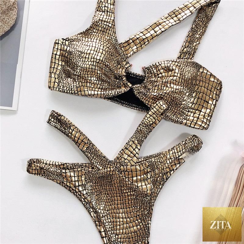 Elegant Stevvex women's snake print bikini set with shiny gold two-piece design, bandeau style, and string bikini bottom.