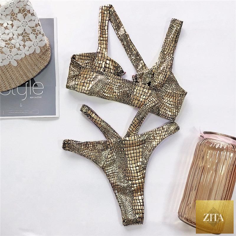 Elegant women’s snake print bikini set by Stevvex featuring shiny gold two-piece swimwear with string design and bandage style.