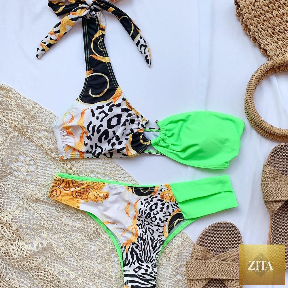 Elegant women's one-shoulder snake print bikini set with matching swim dress and bottom, perfect for spring beach and surf.