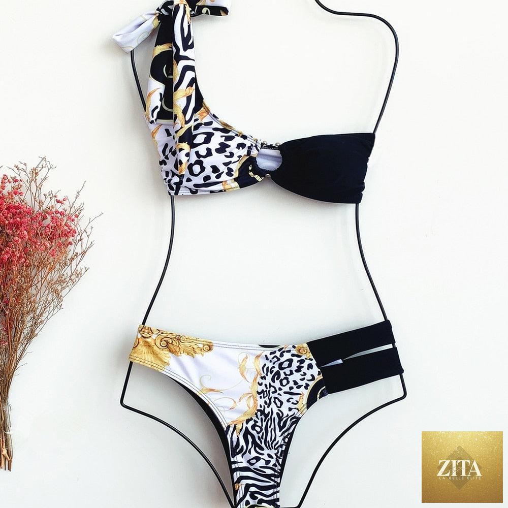 Elegant women's one-shoulder snake print bikini with matching swim dress and bottoms, perfect for spring beach and surf activities.
