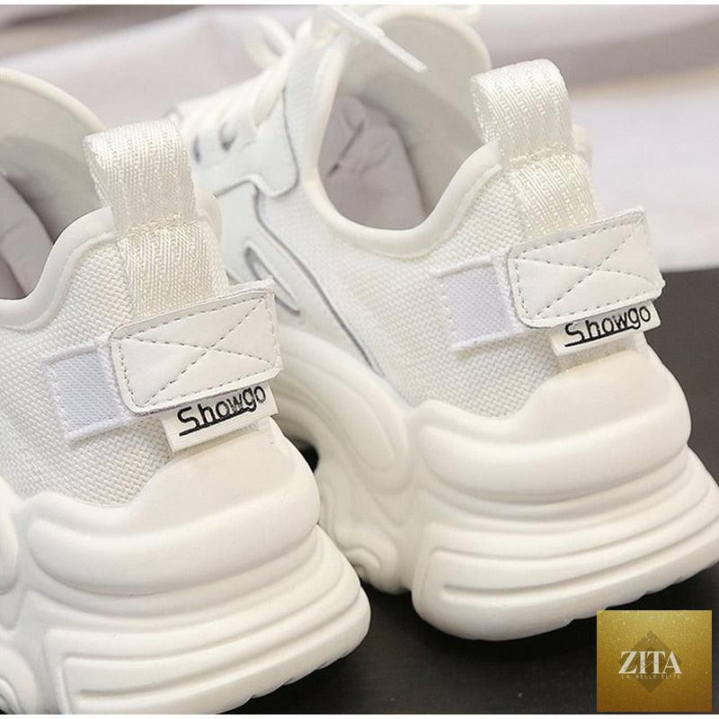Elegant women's Stevvex sneakers with lace-up design, thick platform sole, leather upper, and casual comfortable walking style.