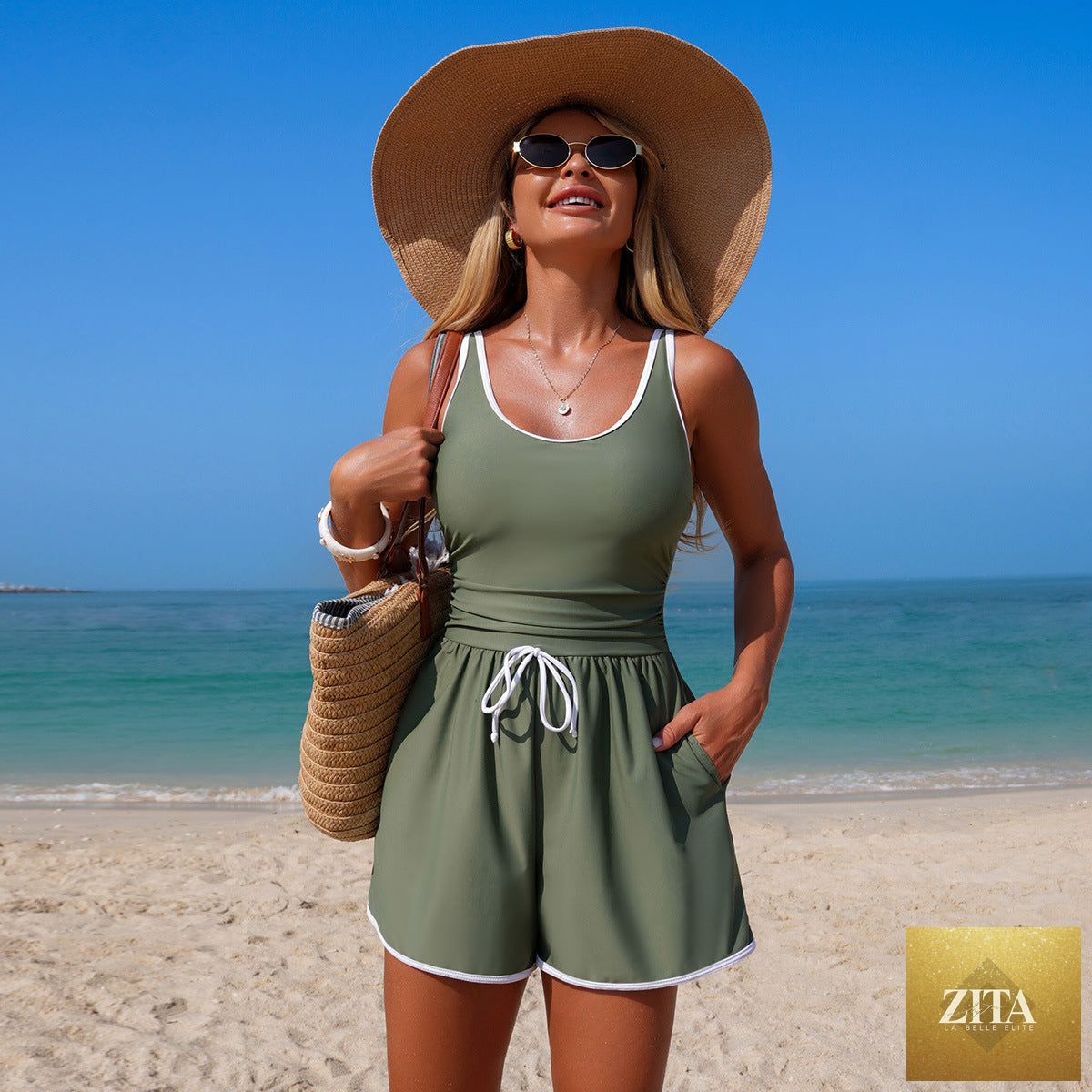 Women's minimalist Zita La Belle Elite sports one-piece swimsuit in solid color with sleeveless design, ideal for active swimwear.