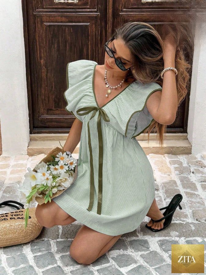 Women's V-neck ruffle puff sleeve mini dress by FitiqueFit featuring a flirty summer style with a fitted waist and playful ruffle details.