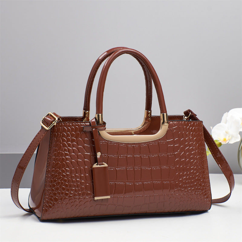 Elegant women's genuine leather wedding bag with shoulder and crossbody straps, featuring a sleek design and classic style.