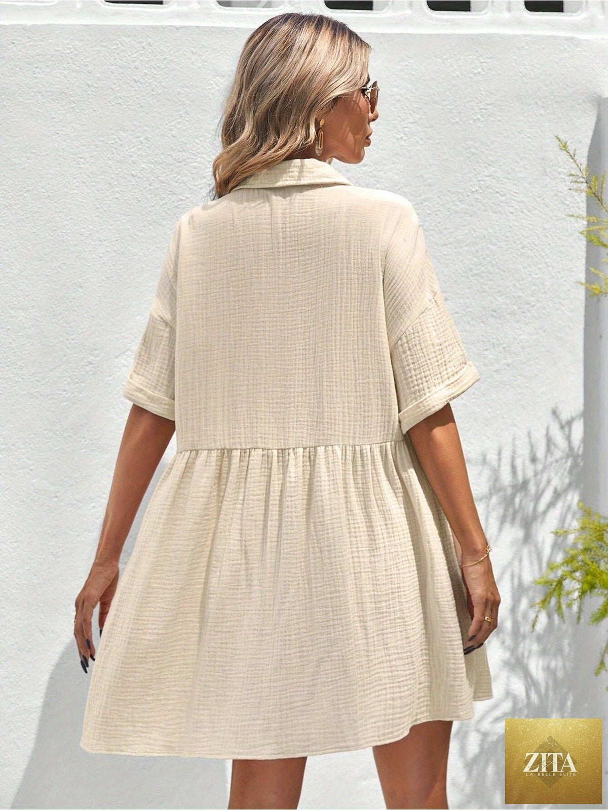 Women’s loose fit ruffle hem shirt dress in casual summer holiday style by Zita La Belle Elite, featuring a relaxed fit and ruffled hem.