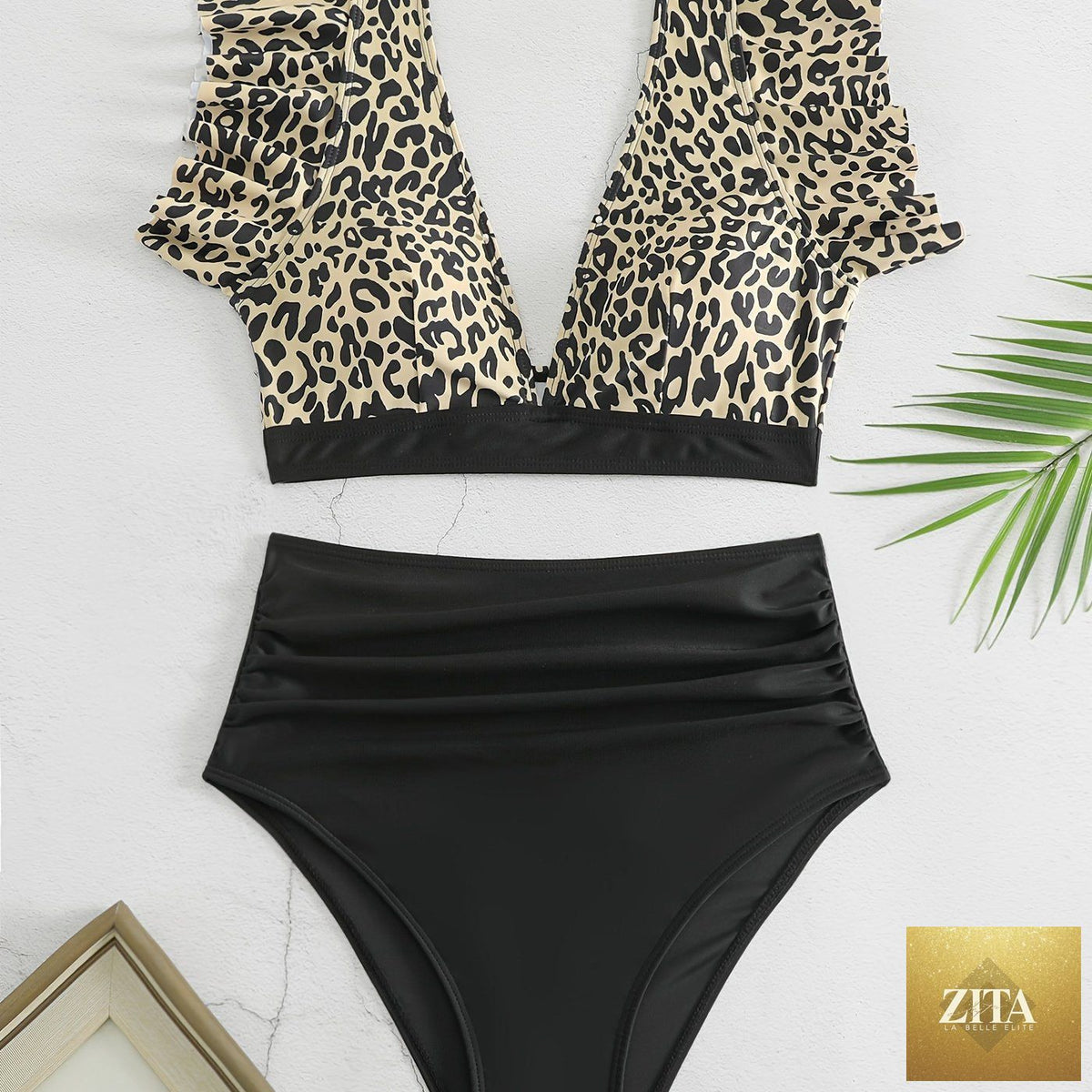 Black solid color bikini set with ruffle V-neck top and high-waisted lettuce trim bottoms, stylish swimwear for women by Stevvex.
