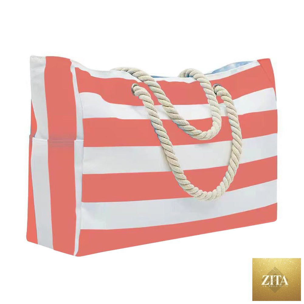 Embroidered striped beach bag with large capacity, stylish design, and sturdy handles, perfect for carrying beach essentials.