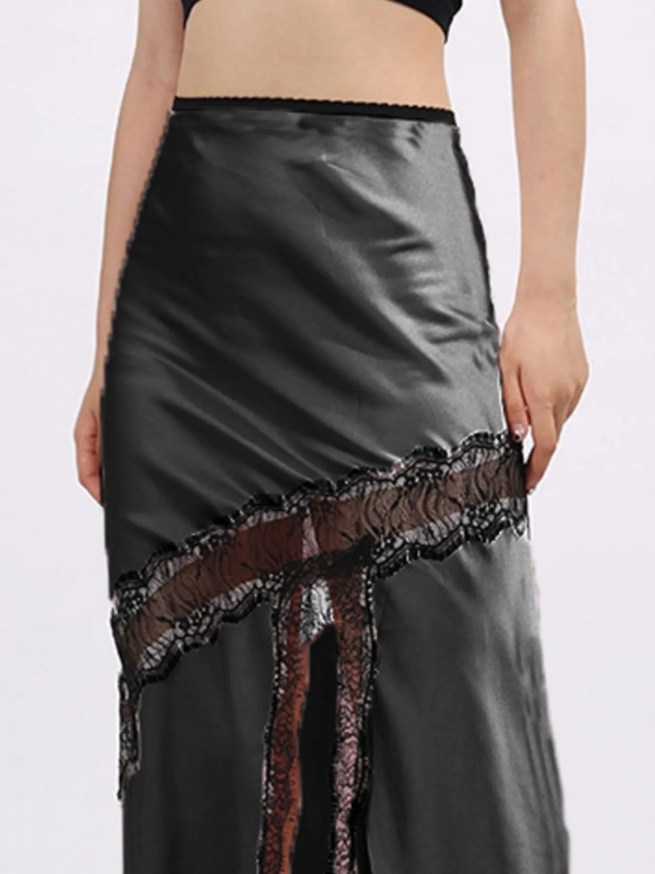 Lace trim asymmetrical midi skirt from The Fashion Celestial featuring flowing fabric and a stylish, uneven hem design.