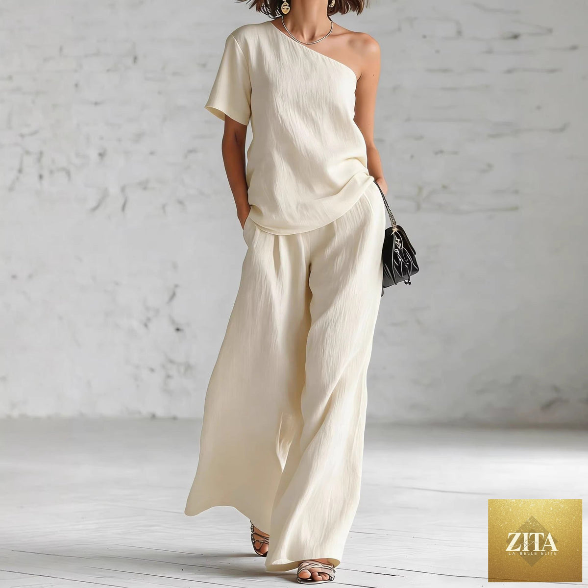 Women's wide-leg pants and top set by Zita La Belle Elite, casualwear outfit with three-quarter sleeves, in neutral fabric.