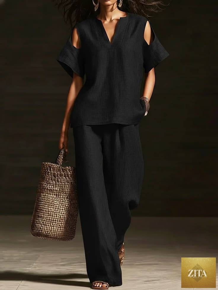 Zita La Belle Elite two-piece set with V-neck short sleeve top and straight-leg pants, featuring ripped detail and pockets in solid color.