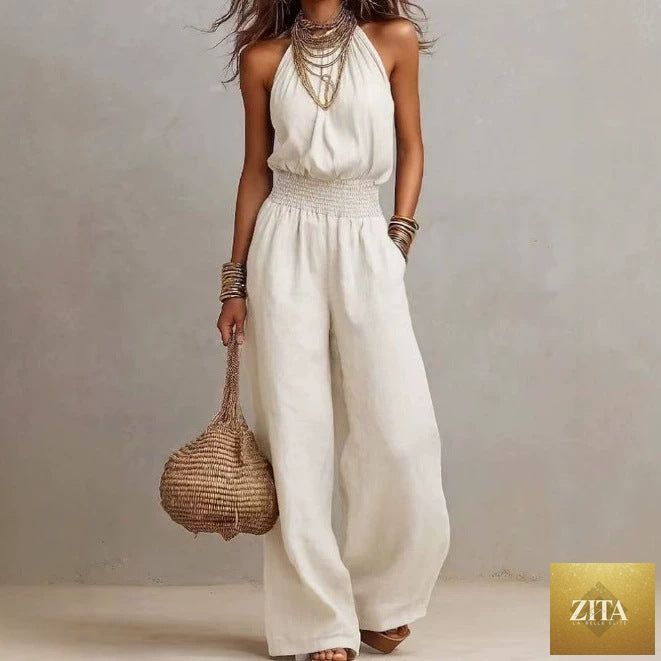 Women's FitiqueFit halter-neck backless wide-leg jumpsuit in solid color, stylish streetwear jumpsuit with flowing wide-leg design.
