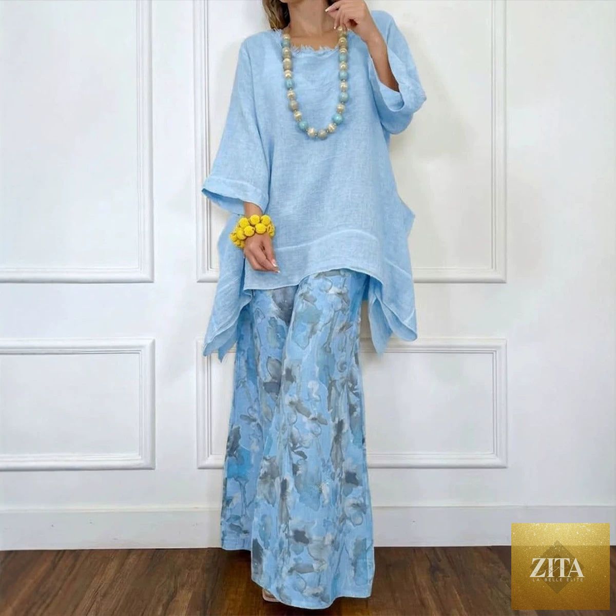 Cotton-linen irregular hem drop-shoulder top and wide-leg pants set by Zita La Belle Elite in three colors, laid flat.