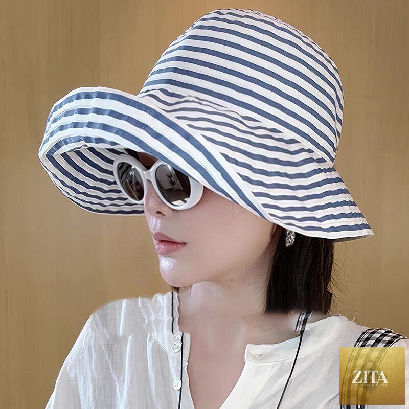 Women's wide-brim striped sun hat by Zita La Belle Elite with UV protection and adjustable fit, perfect for sunny outdoor days.