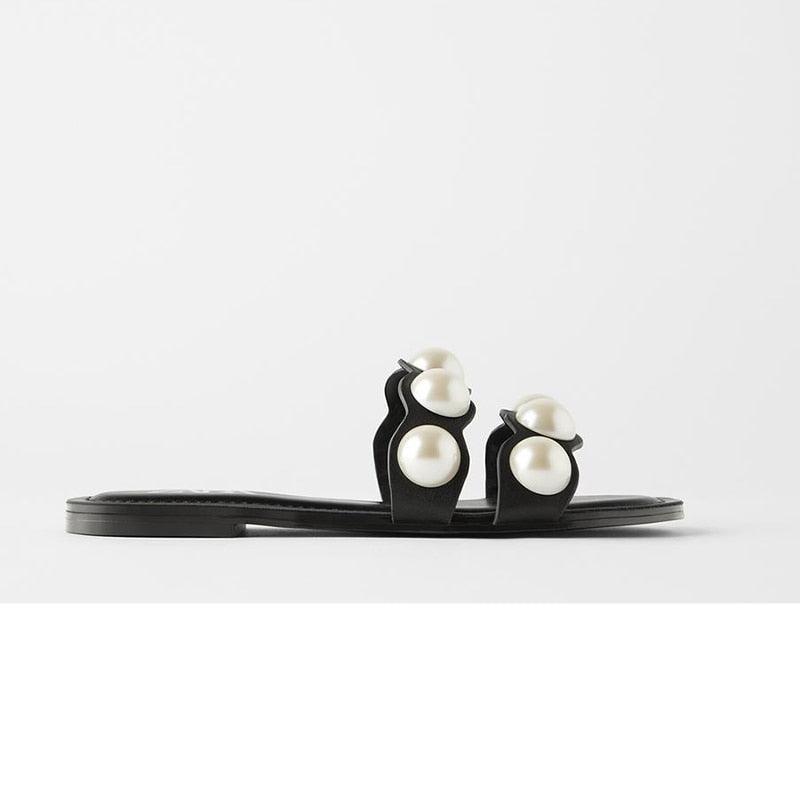 Stevvex pearl flat sandals for women, casual beach flip flops with slip-on style and elegant pearl details.