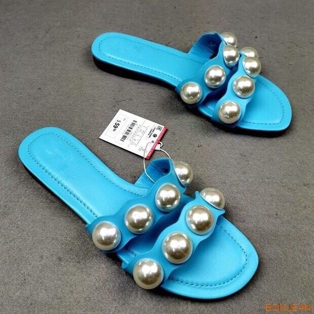 Stevvex pearl flat sandals for women, slip-on beach flip flops with decorative pearls, perfect for casual summer and beach wear.