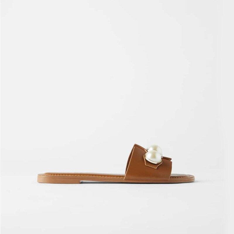 Stevvex pearl flat sandals for women, slip-on beach flip flops with decorative pearls, perfect for casual and bridal summer occasions.
