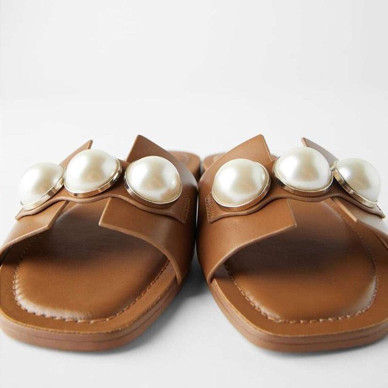 Stevvex pearl flat sandals for women, slip-on beach slippers with elegant pearls, suitable for casual, summer, and bridal occasions.
