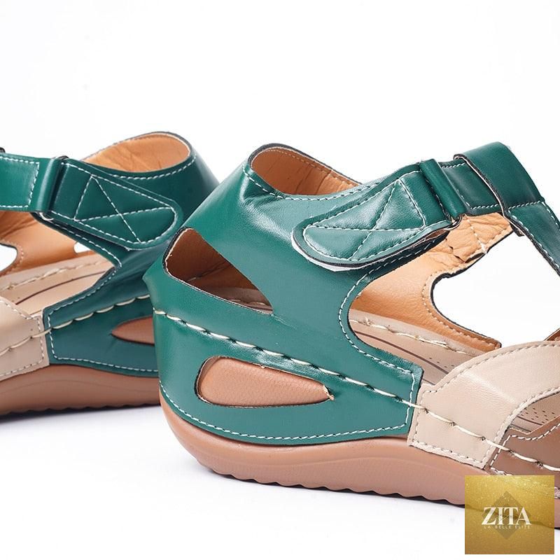 Stevvex women's waterproof slip-on summer flat sandals with round toes, leather material, arch support, and casual outdoor style.
