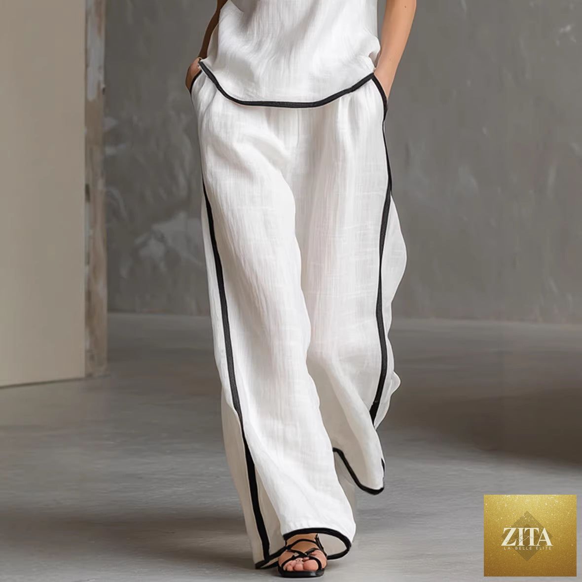 Women’s sleeveless V-neck wide-leg pants set by Zita La Belle Elite, featuring a casual sleeveless top and relaxed wide-leg trousers.