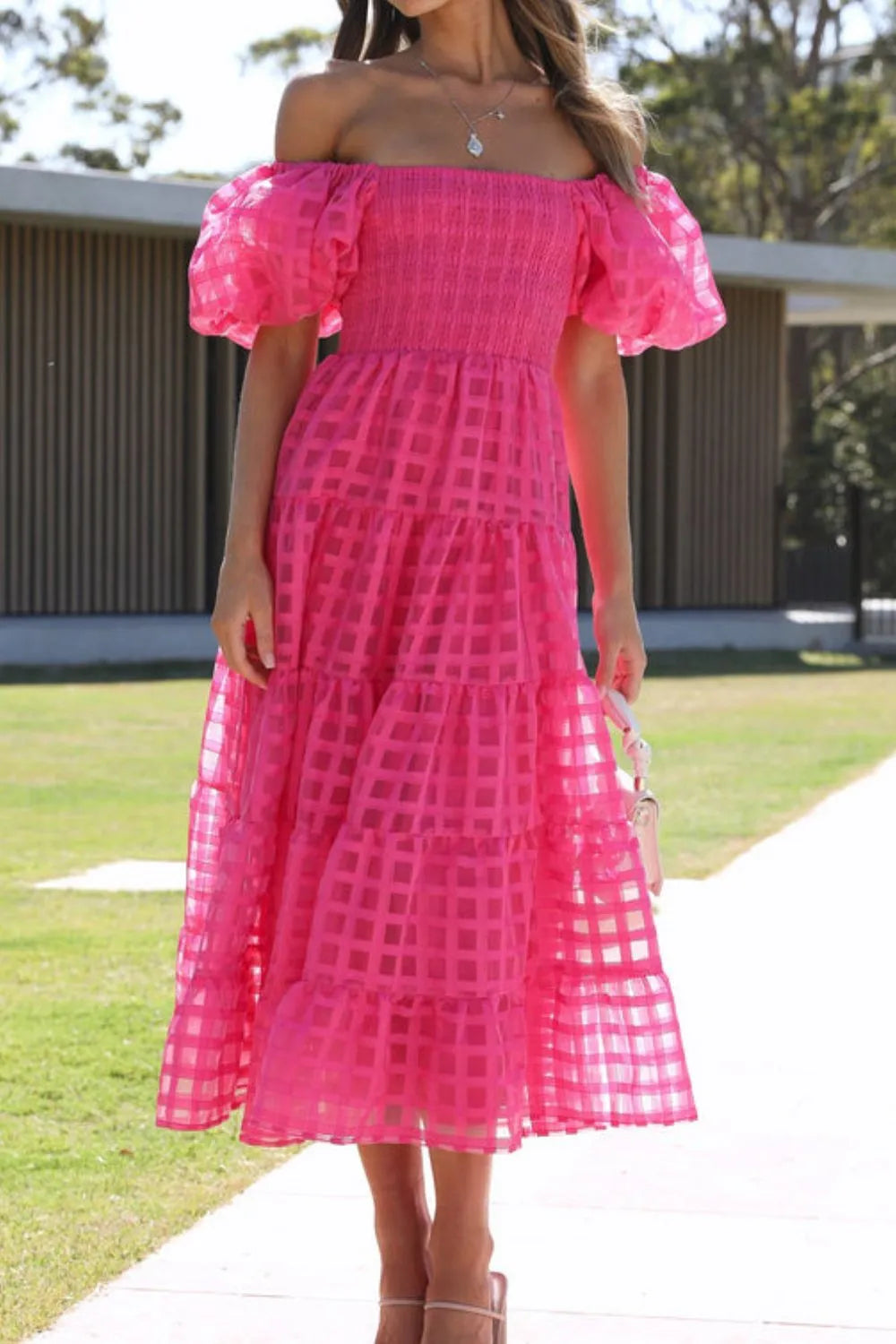 Off shoulder short puff sleeve midi dress by Shopiebay, showing a flowy fabric with a fitted waist and stylish neckline.