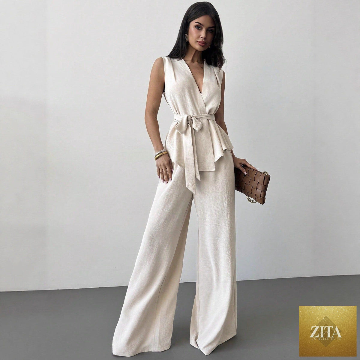 Women's lace-up V-neck vest and matching pants two-piece set by Zita La Belle Elite, shown on a model.