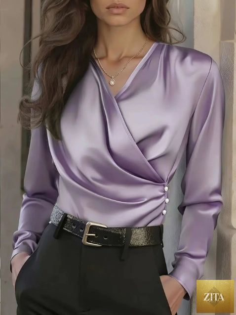 Women's elegant FitiqueFit cross V-neck blouse with ruffle details and button accents, perfect for office casualwear.