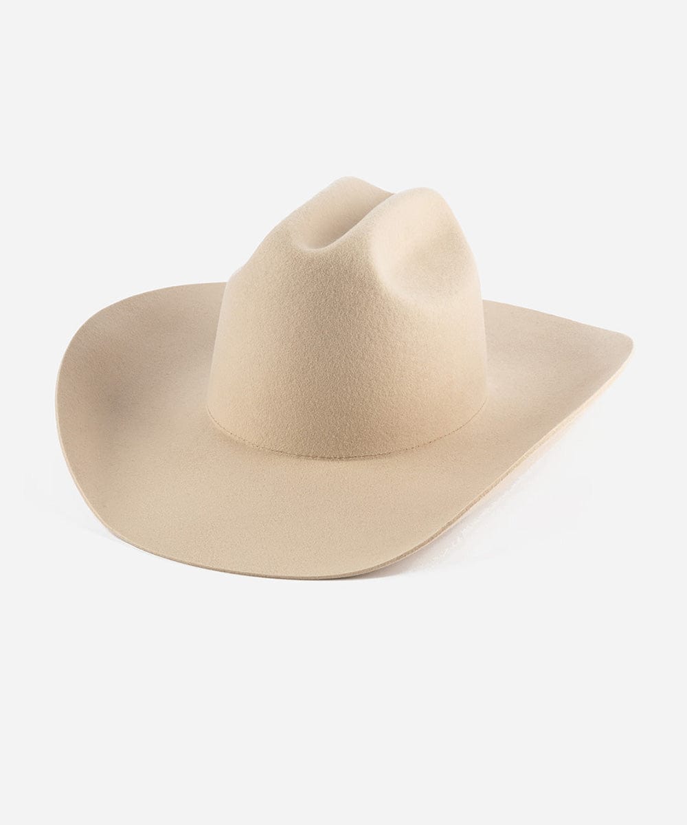 Cream felt Teddy Cattleman cowboy hat by GIGI PIP with a wide brim and classic Western style, shown from a side view.