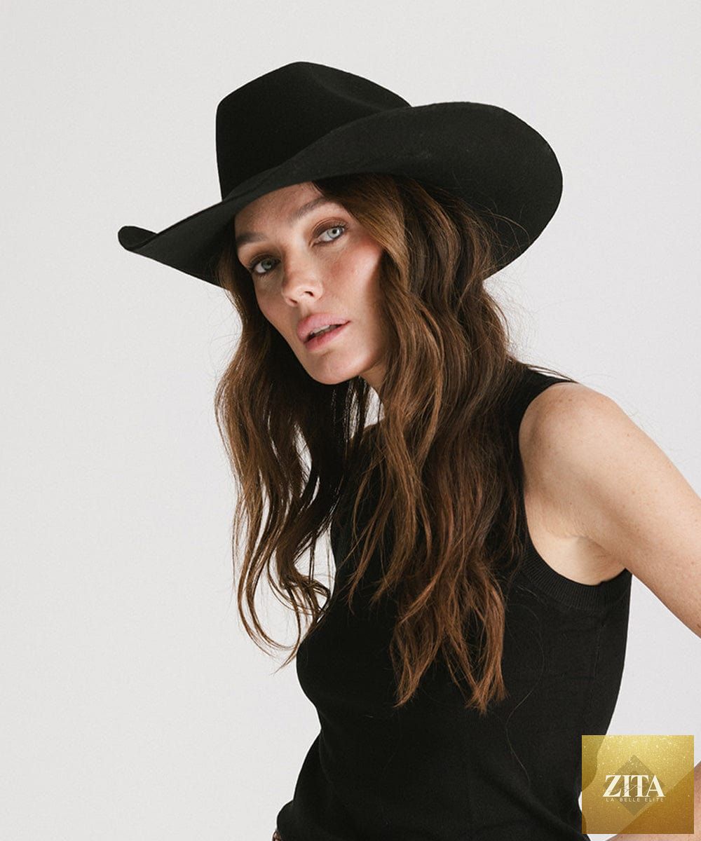 GIGI PIP Shane cowboy hat made of beige felt with a wide brim and decorative band, stylish Western headwear.