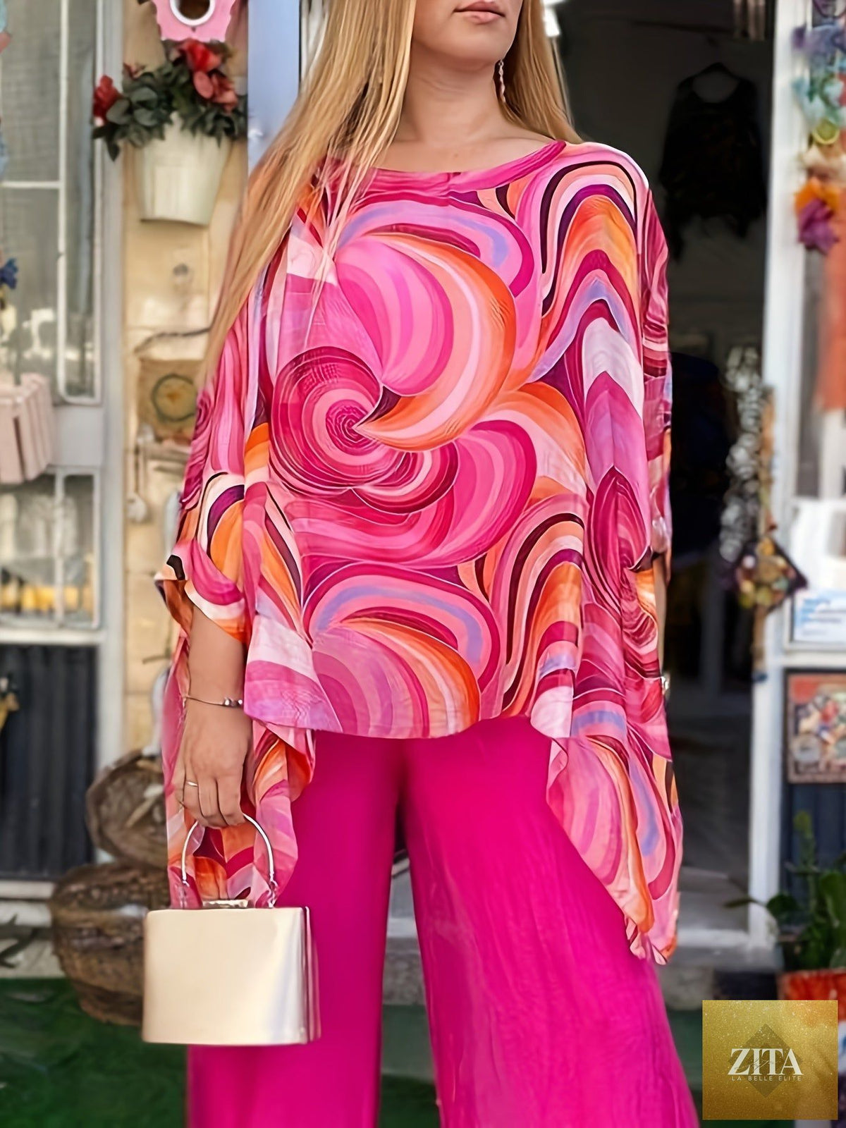 Floral chiffon breezy women’s two-piece pants set with chic style, featuring a flowy top and matching wide-leg pants in a colorful floral pattern.