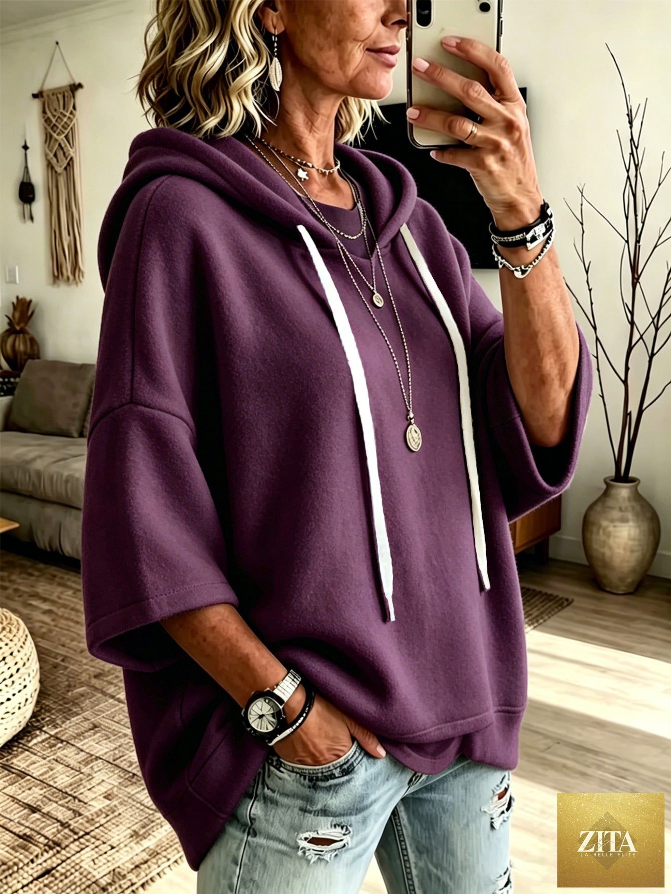 Women's oversized batwing sleeve hoodie by FitiqueFit, loose fleece pullover with relaxed fit and cozy comfort.